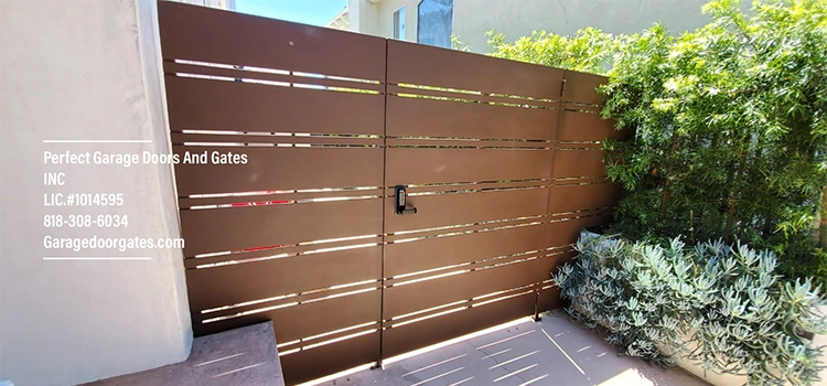 Orange Mid-Century Modern Driveway Gate Installation